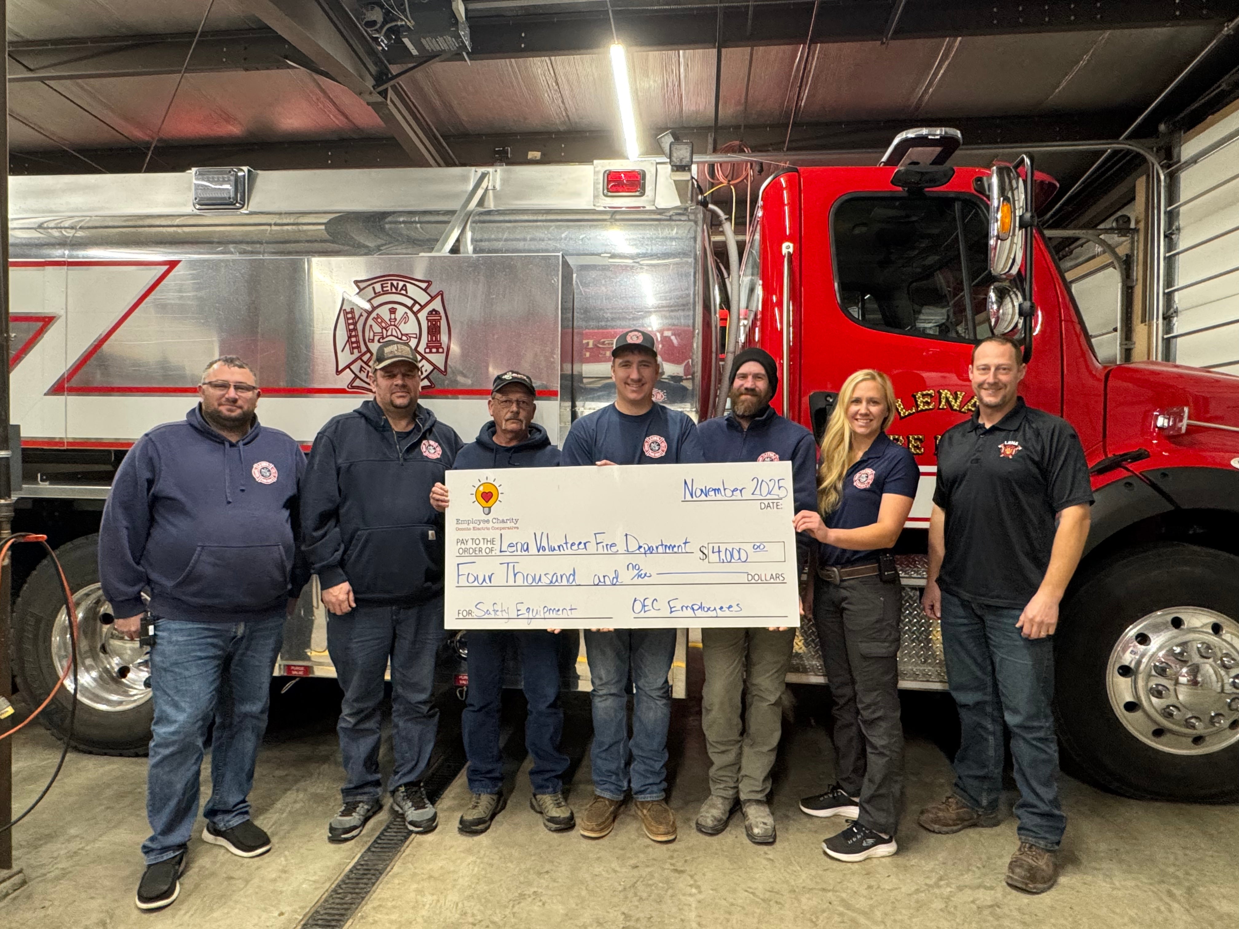 Lena Fire Department with check for $4,000